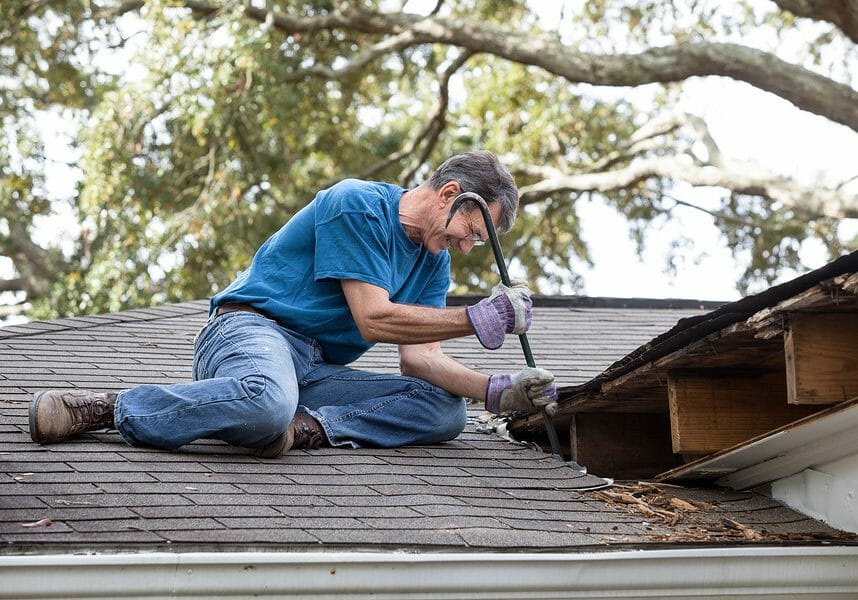 Homeowner repairing his roof